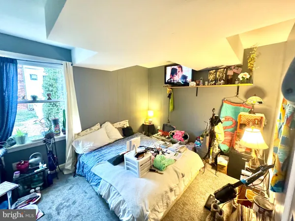 a view of living room filled with furniture and floor to ceiling window