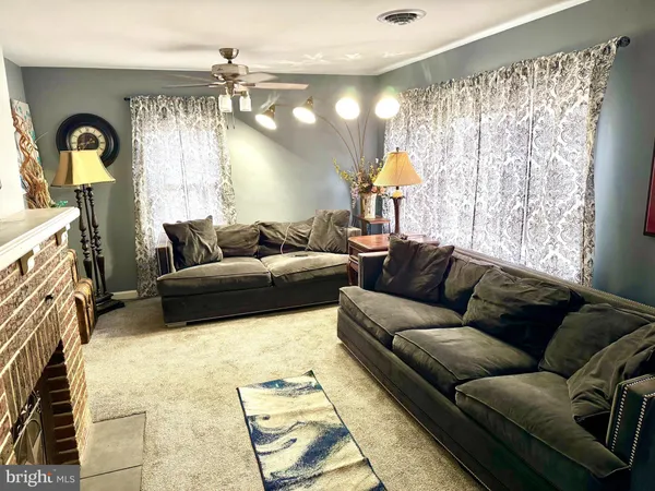 a view of a livingroom with furniture and a table