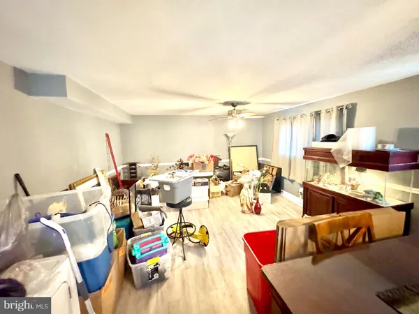 a kitchen with a stove a sink and a refrigerator