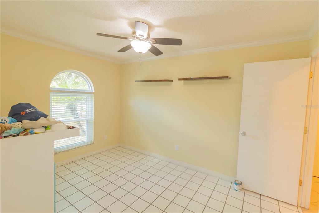 3908 Rosedale Drive Brandon, FL 33511 - Photo 11 of 44 a view of a livingroom with wooden floor and a ceiling fan