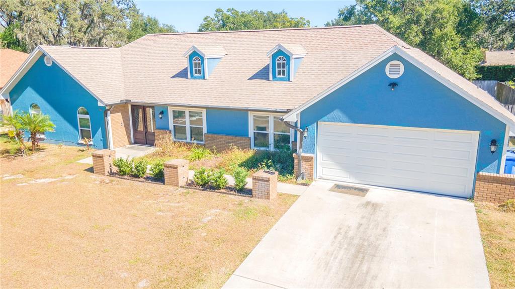 3908 Rosedale Drive Brandon, FL 33511 - Photo 2 of 44 a front view of a house with a yard