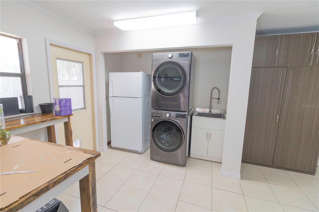 3908 Rosedale Drive Brandon, FL 33511 - Photo 35 of 44 a utility room with sink dryer and washer