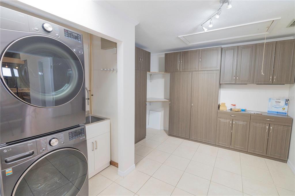 3908 Rosedale Drive Brandon, FL 33511 - Photo 39 of 44 a view of a storage & utility room with cabinets
