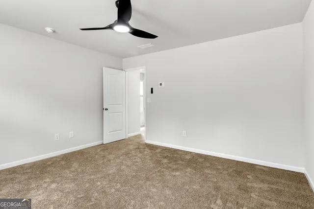 a bathroom with a granite countertop bathtub shower sink and vanity