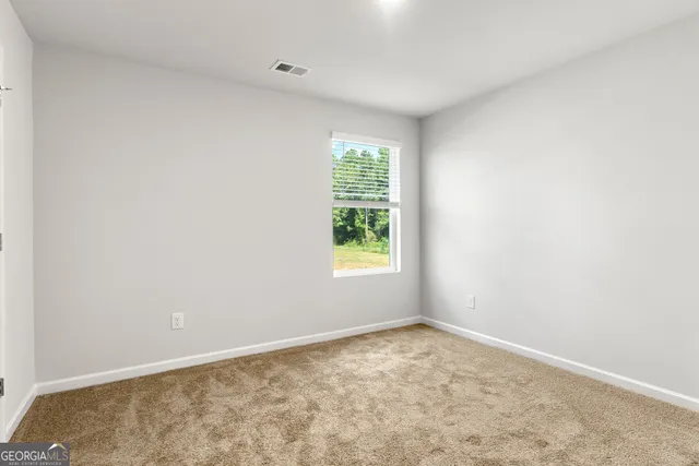 an empty room with window