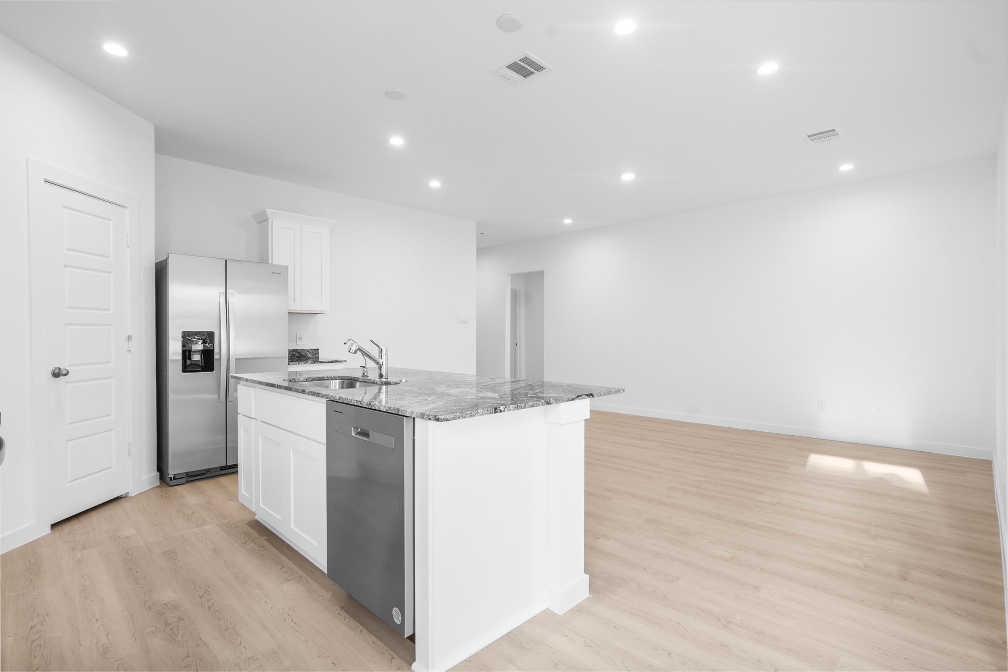 11 Robin Court Angleton, TX 77515 - Photo 4 of 21 a kitchen with a sink stainless steel appliances and cabinets