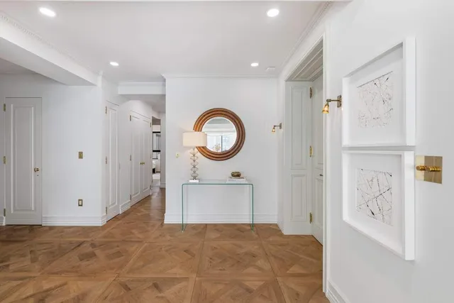 a spacious bedroom with a bed and a cabinets
