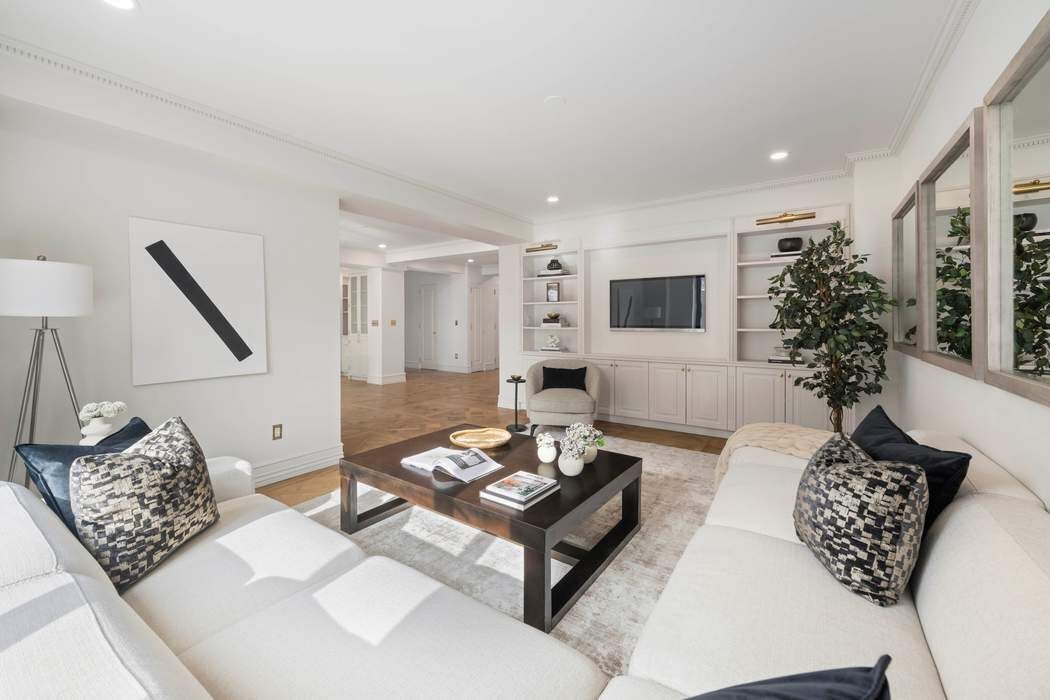 47 East 87th Street, Unit 7A Manhattan, NY 10128 - Photo 5 of 14 a living room with furniture and wooden floor