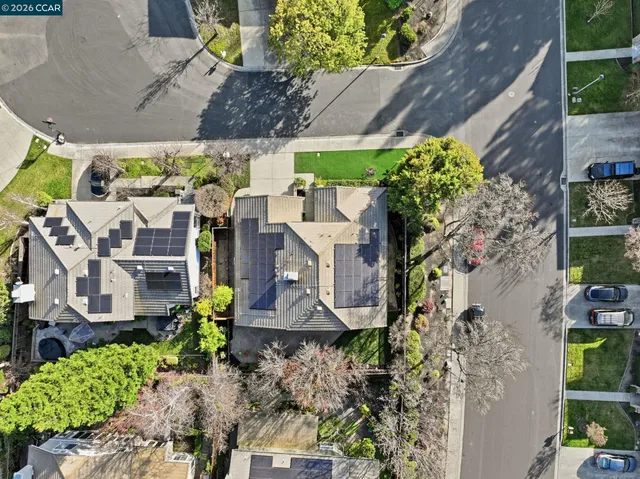 an aerial view of residential houses with outdoor space
