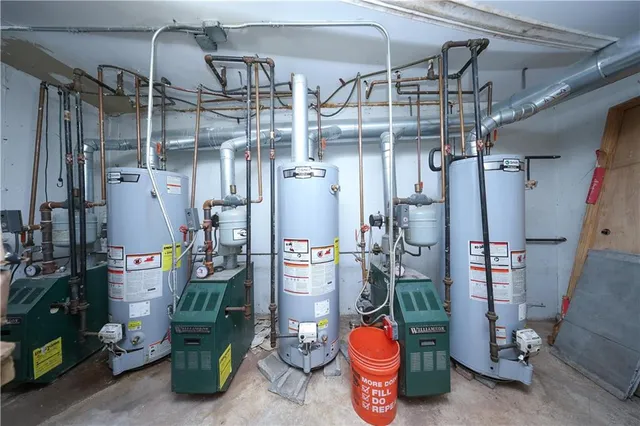 a view of a house with backyard and parking