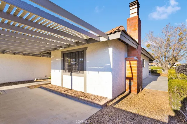 a view of a room with wooden floor and window