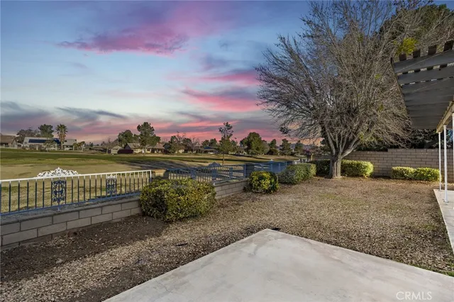 a view of a lake with a houses in the background