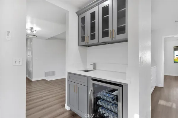 a kitchen with stainless steel appliances a stove a microwave and cabinets