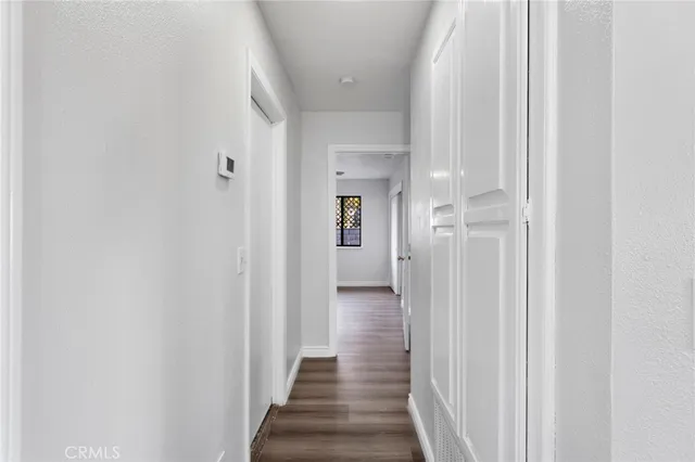 a bathroom with a sink vanity and toilet
