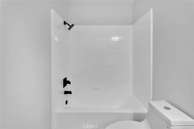 a bathroom with a shower and a mirror