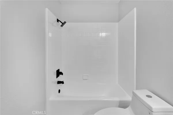 a bathroom with a shower and a mirror