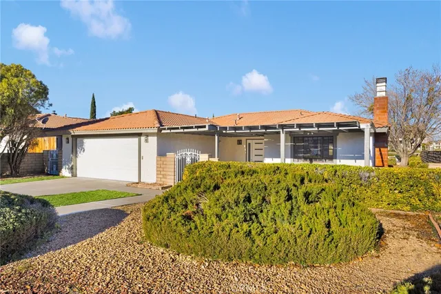 front view of a house with a large window