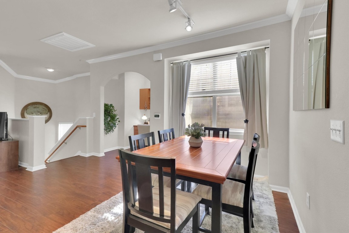11203 Ranch Road 2222, Unit 2305 Austin, TX 78730 - Photo 12 of 36 a view of a dining room with furniture and a window