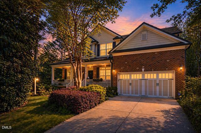 12212 Ashton Woods Lane Raleigh, NC 27614 - Photo 1 of 50 a front view of a house with garden