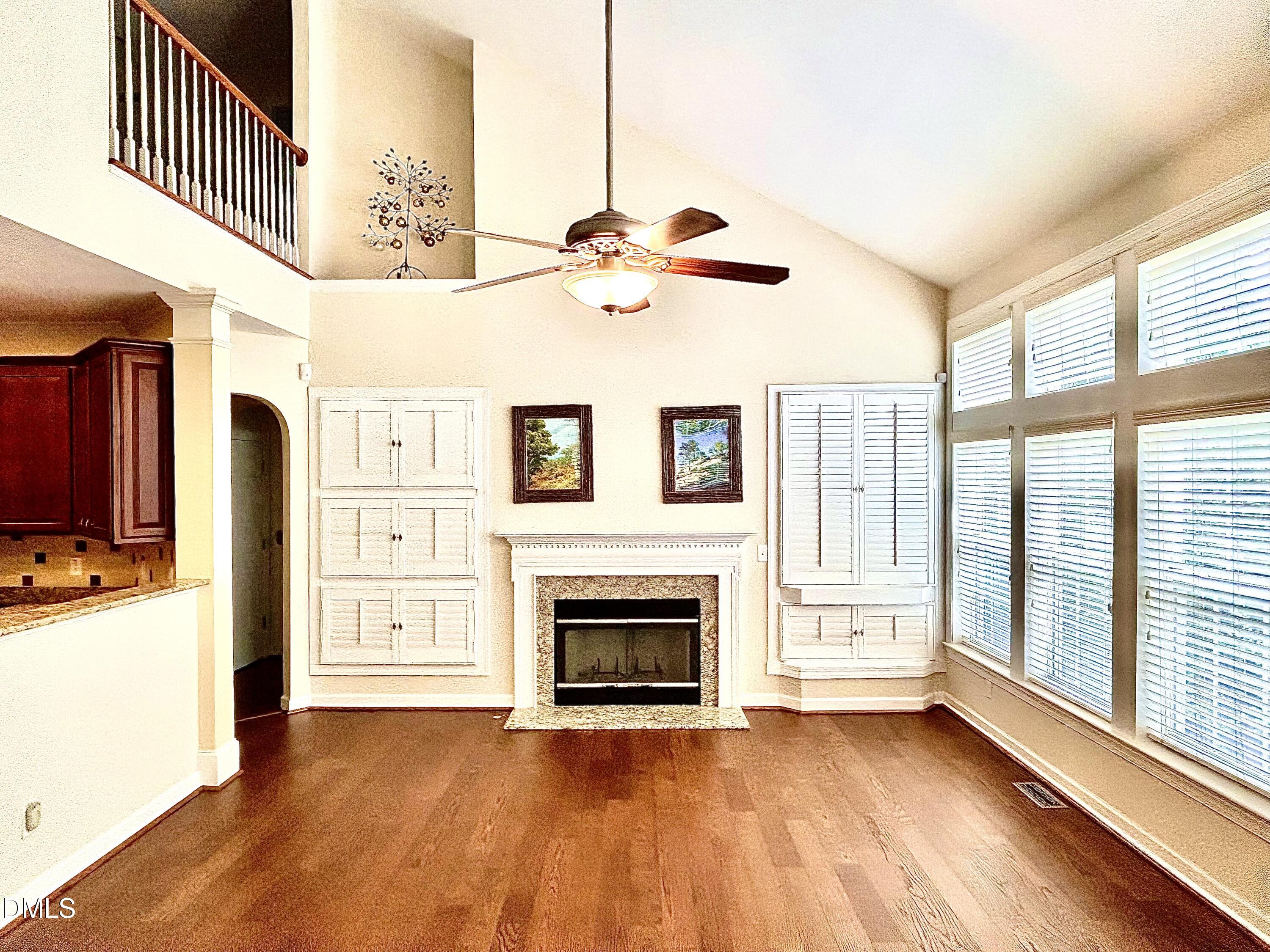 12212 Ashton Woods Lane Raleigh, NC 27614 - Photo 14 of 50 a view of an empty room with a fireplace and a window