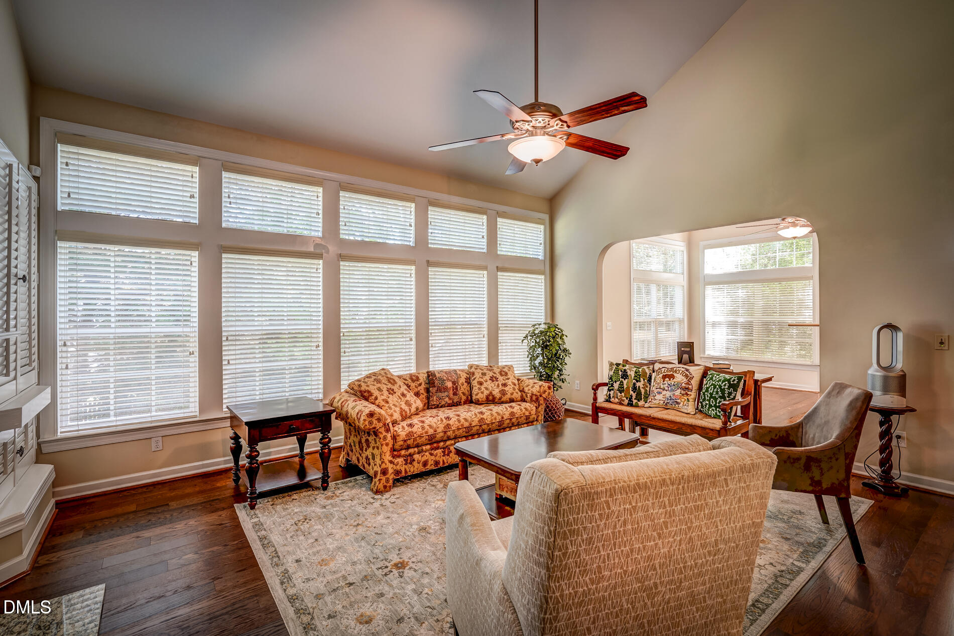 12212 Ashton Woods Lane Raleigh, NC 27614 - Photo 20 of 50 a living room with furniture and floor to ceiling windows