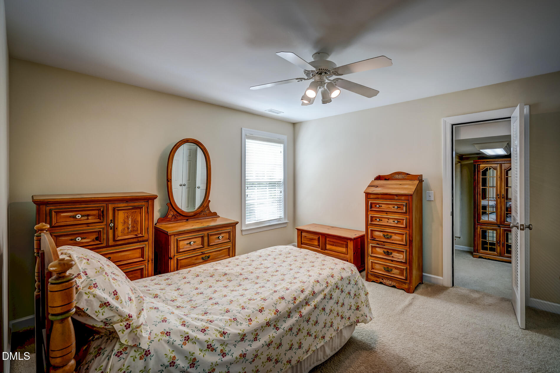 12212 Ashton Woods Lane Raleigh, NC 27614 - Photo 29 of 50 a bedroom with a bed a dresser and chair