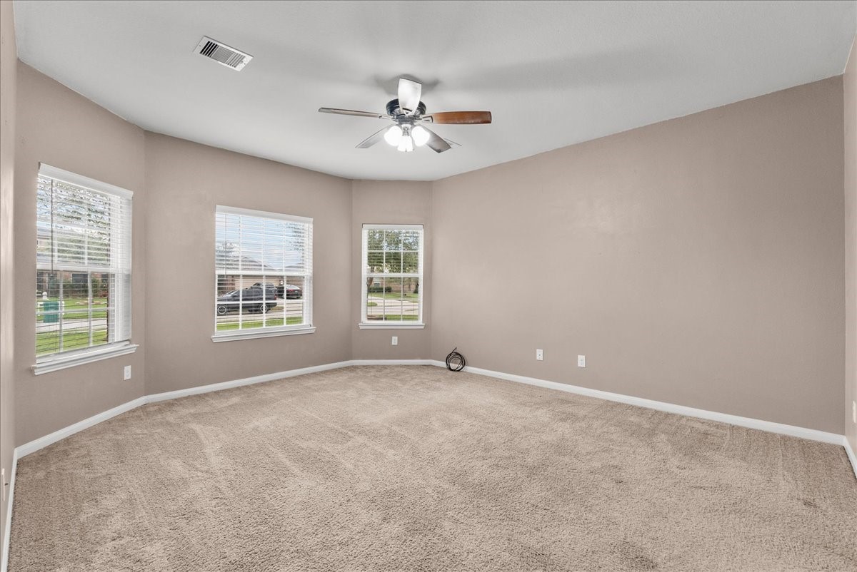 322 Shoshone Ridge Drive La Marque, TX 77568 - Photo 17 of 34 a view of an empty room with a window