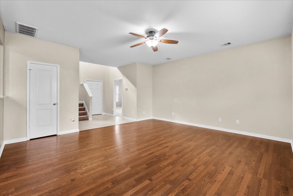 322 Shoshone Ridge Drive La Marque, TX 77568 - Photo 7 of 34 a view of an empty room with wooden floor