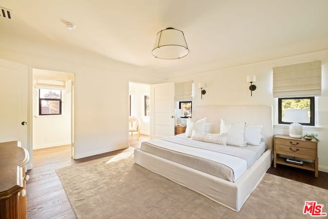 a view of a room with a table and chairs