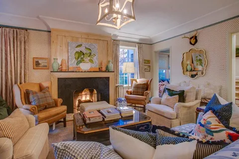 a dining room with furniture and window