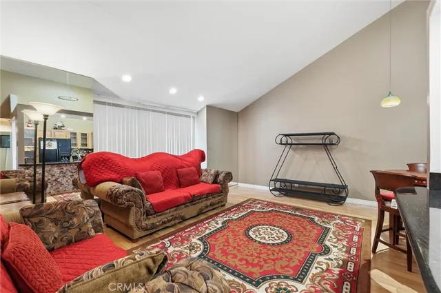 a living room with furniture and a rug