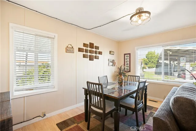 a view of a dining room with furniture window and outside view