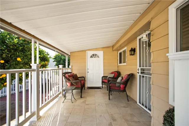 a view of two chairs in the balcony