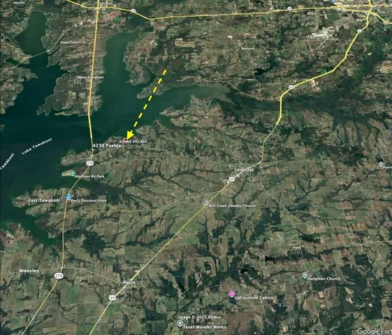 a aerial view of a house with a yard