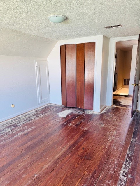 217 Main Street Palacios, TX 77465 - Photo 17 of 45 an empty room with wooden floor and a bathroom