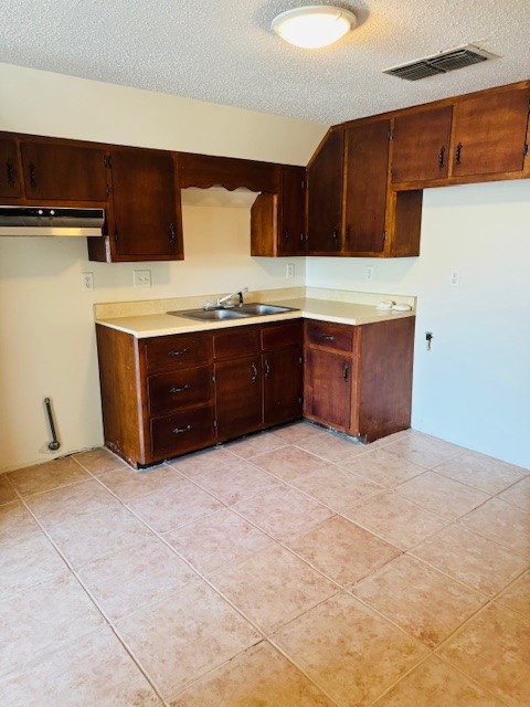 217 Main Street Palacios, TX 77465 - Photo 26 of 45 a bathroom with a granite countertop sink and a bathtub