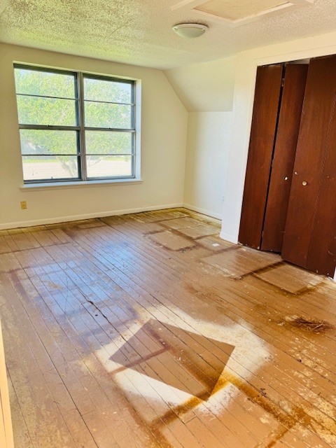217 Main Street Palacios, TX 77465 - Photo 44 of 45 an empty room with wooden floor and windows
