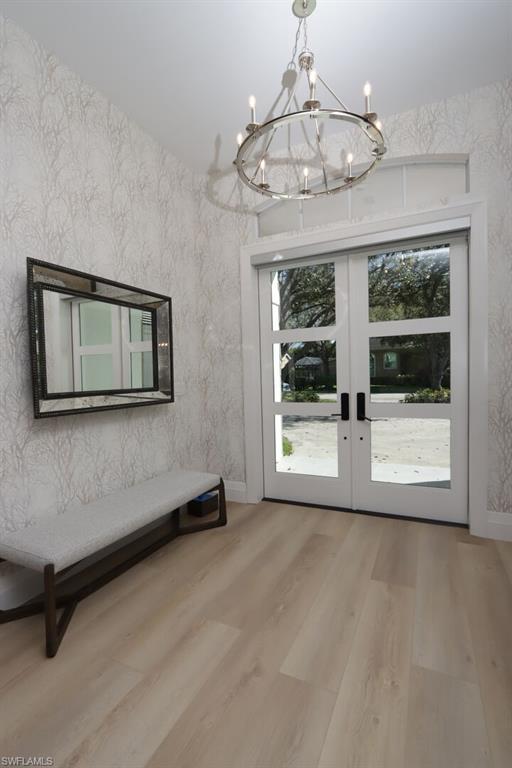 6665 Mill Run Road Naples, FL 34109 - Photo 11 of 30 a view of an empty room with a window