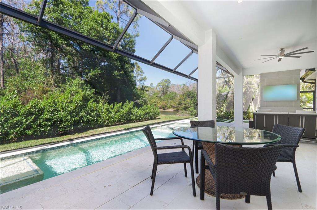 6665 Mill Run Road Naples, FL 34109 - Photo 22 of 30 a dining room with furniture and window