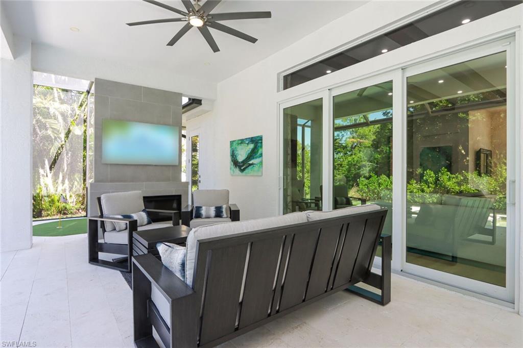 6665 Mill Run Road Naples, FL 34109 - Photo 23 of 30 a view of a porch with chairs