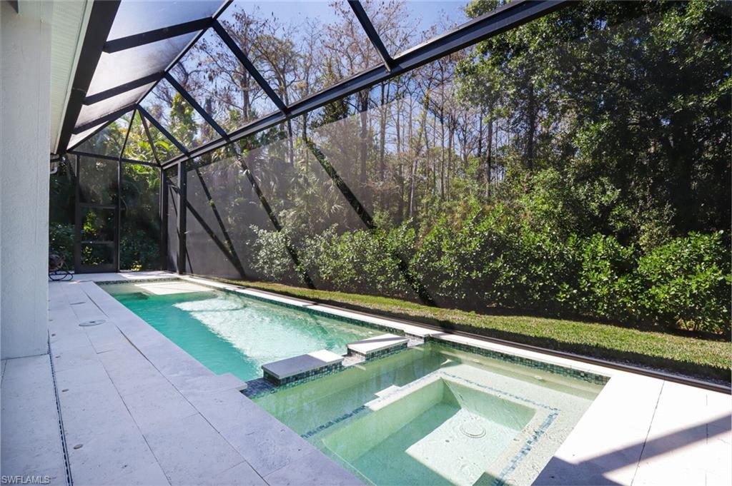 6665 Mill Run Road Naples, FL 34109 - Photo 25 of 30 a view of a backyard with swimming pool
