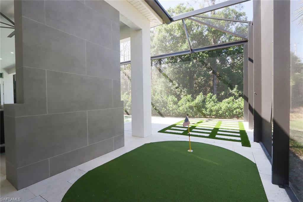 6665 Mill Run Road Naples, FL 34109 - Photo 27 of 30 a view of outdoor space with garden