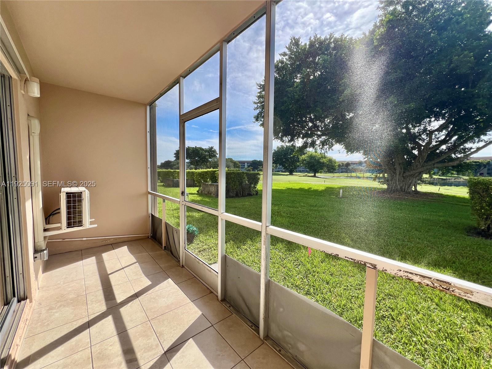 13550 Southwest 6th Court, Unit 109A Pembroke Pines, FL 33027 - Photo 11 of 11 a view of balcony with yard