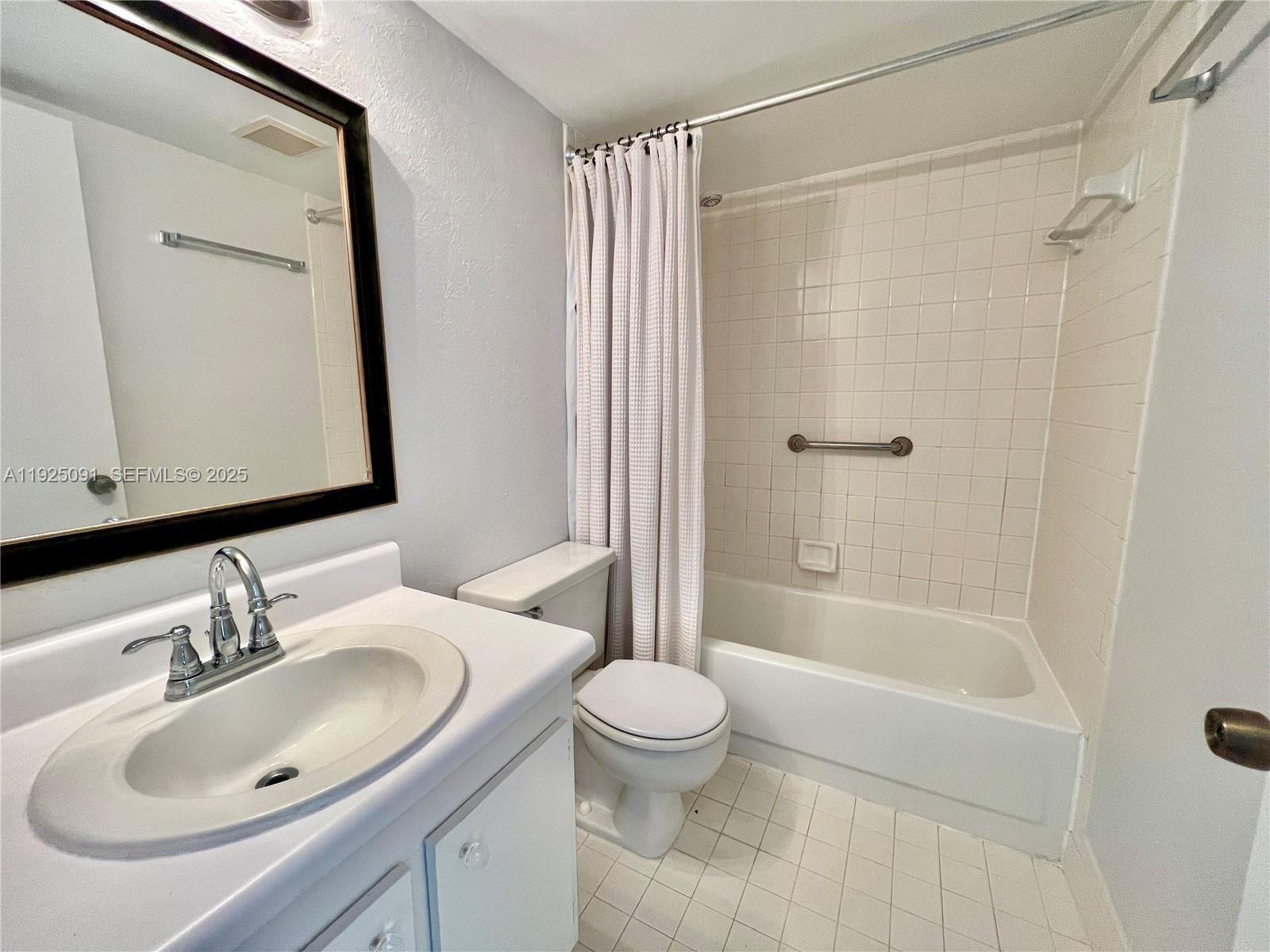 13550 Southwest 6th Court, Unit 109A Pembroke Pines, FL 33027 - Photo 7 of 11 a bathroom with a sink toilet and shower