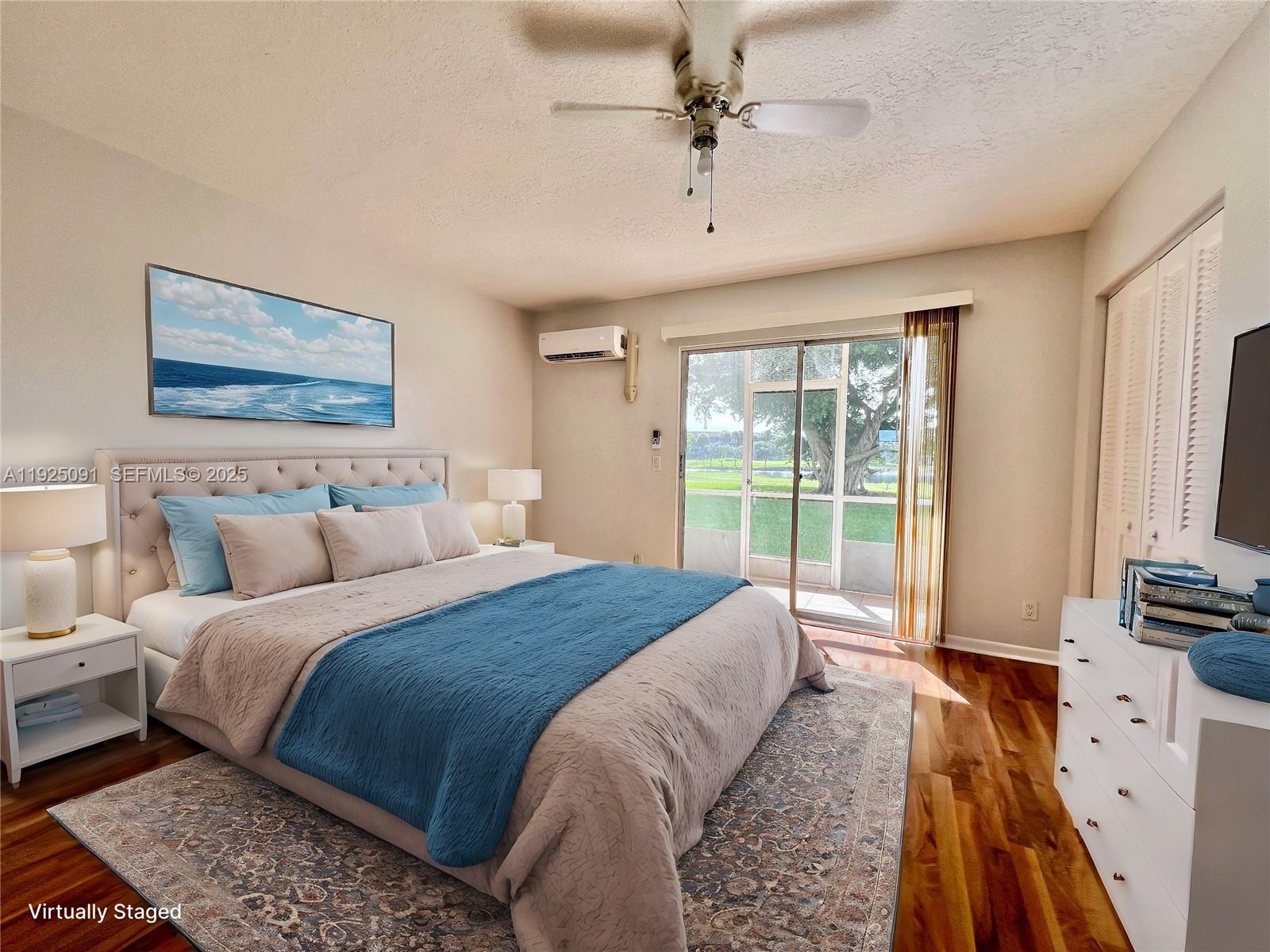 13550 Southwest 6th Court, Unit 109A Pembroke Pines, FL 33027 - Photo 8 of 11 a spacious bedroom with a large bed and a window