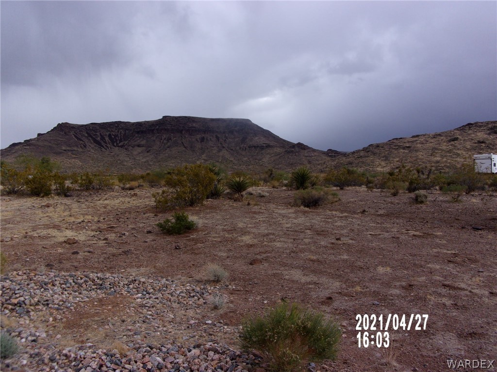 321 South Tooman Road Golden Valley, AZ 86413 - Photo 13 of 16 a view of a dry yard with mountain