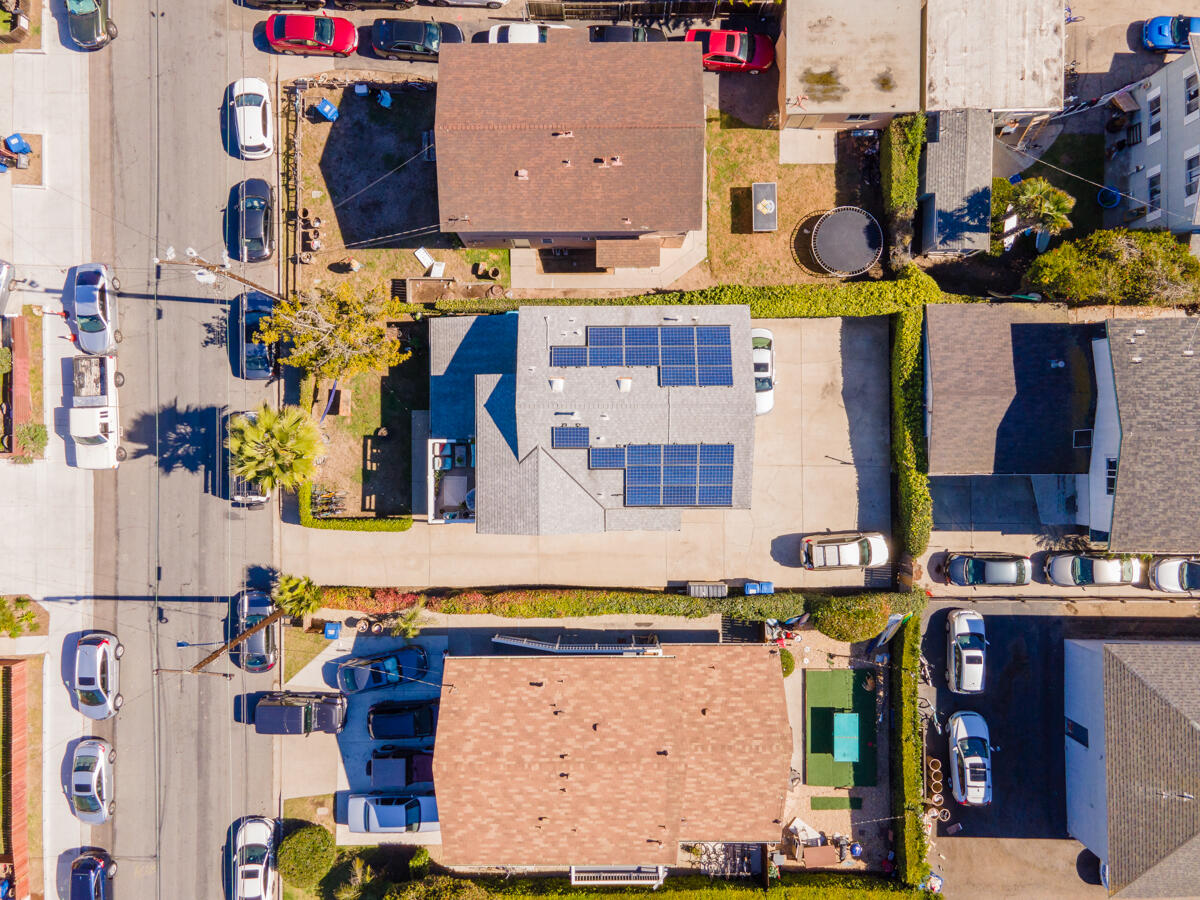 6709 Trigo Road Goleta, CA 93117 - Photo 6 of 13 a utility room with lots of clutter and cabinets