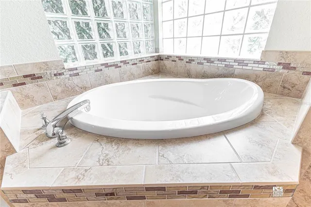 a view of a bath tub sitting in a bathroom