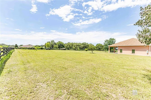 a front view of a house with a lake view