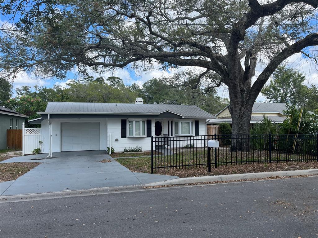 550 3rd Street Southwest Largo, FL 33770 - Photo 1 of 1 a front view of a house with a garden